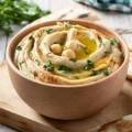 Hummus with Braised white beans & Pine nuts